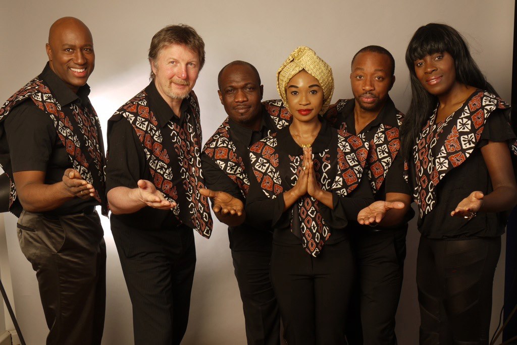 Buki with five members of the band